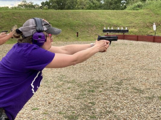 Woman shooting gun practice