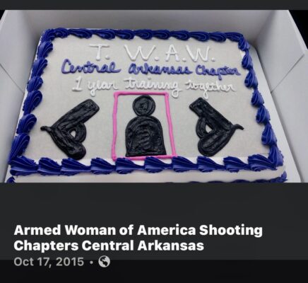 Cake with white frosting, firearms and purple frosting on the edge.